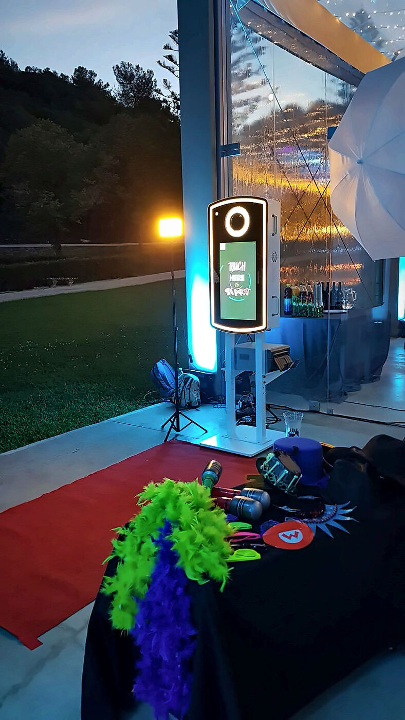 Photo booth at an outdoor event at sunset
